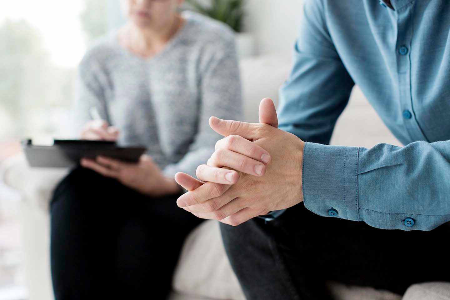 close-up of therapist and client's hands during an EMDR therapy session